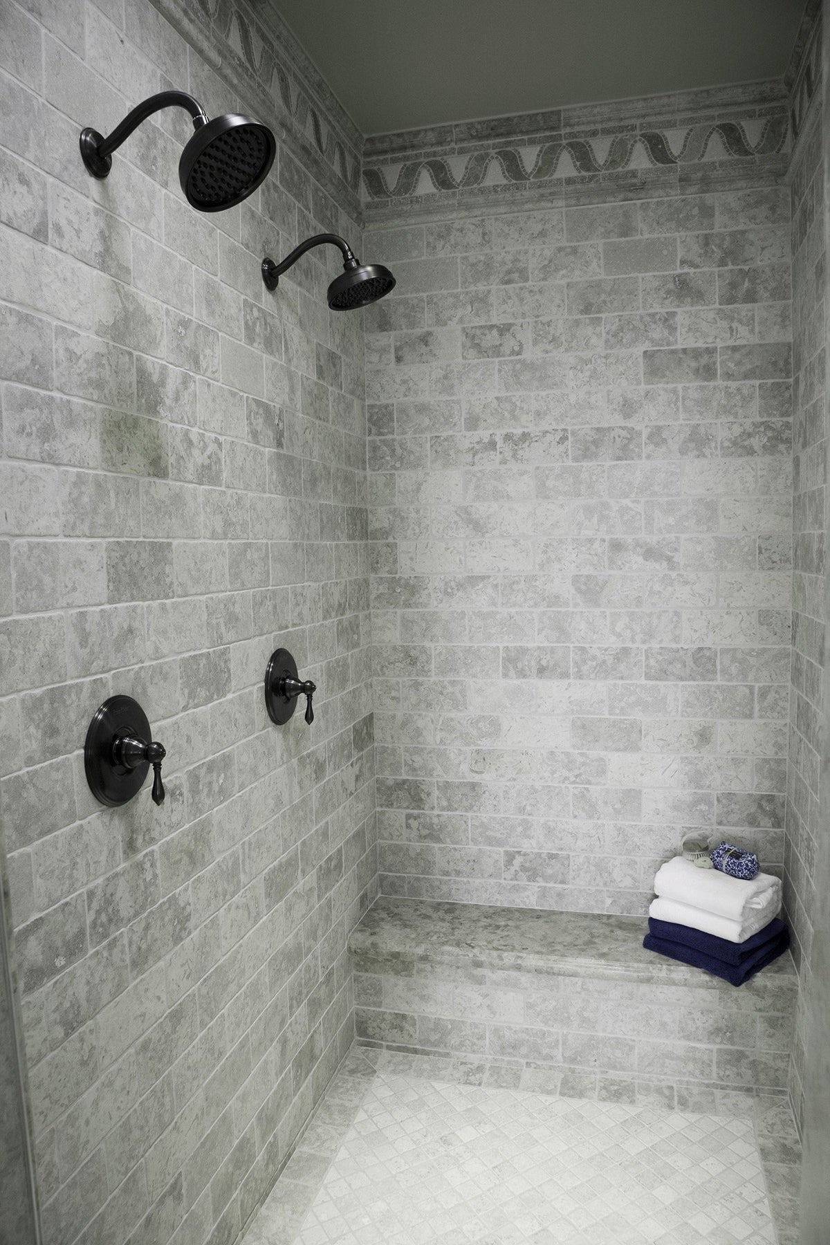 Tiled double-head shower sealed with GreenSeel membrane against mold and mildew